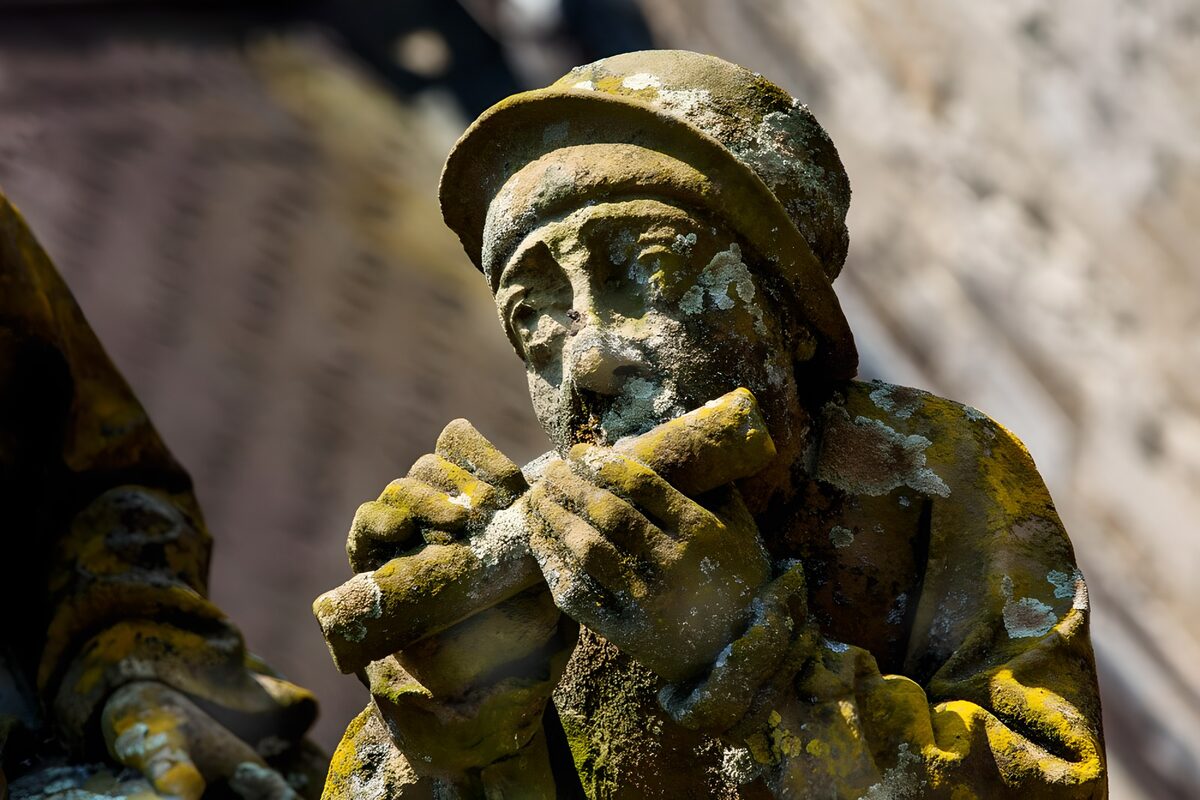 Weathered Musician Sculpture