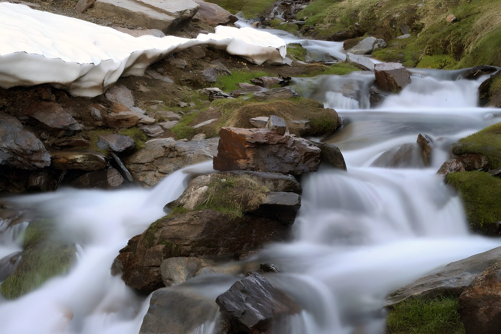 OCUK66467: Gentle Cascade Over Rocky Terrain
