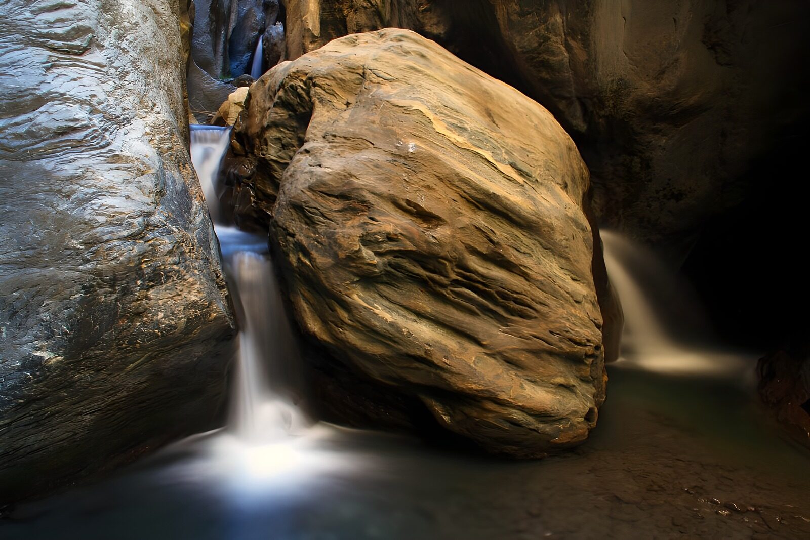 OCUK33417: Serene Waterfall Among Giant Boulders