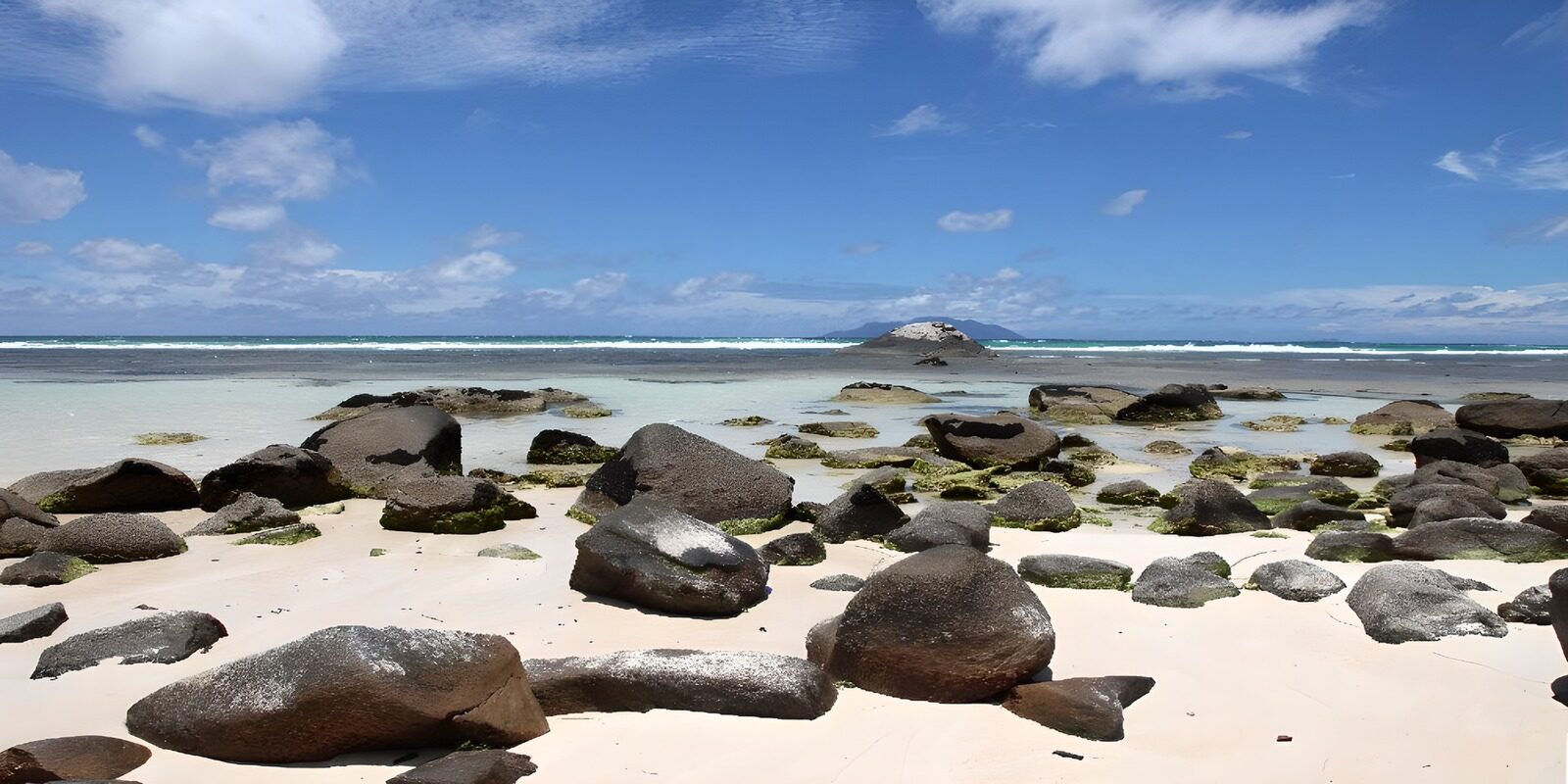 OCUK91296: Tranquil Shoreline with Rocky Outcrops