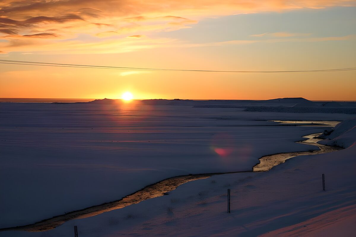Serene Sunset over Snowy Landscape
