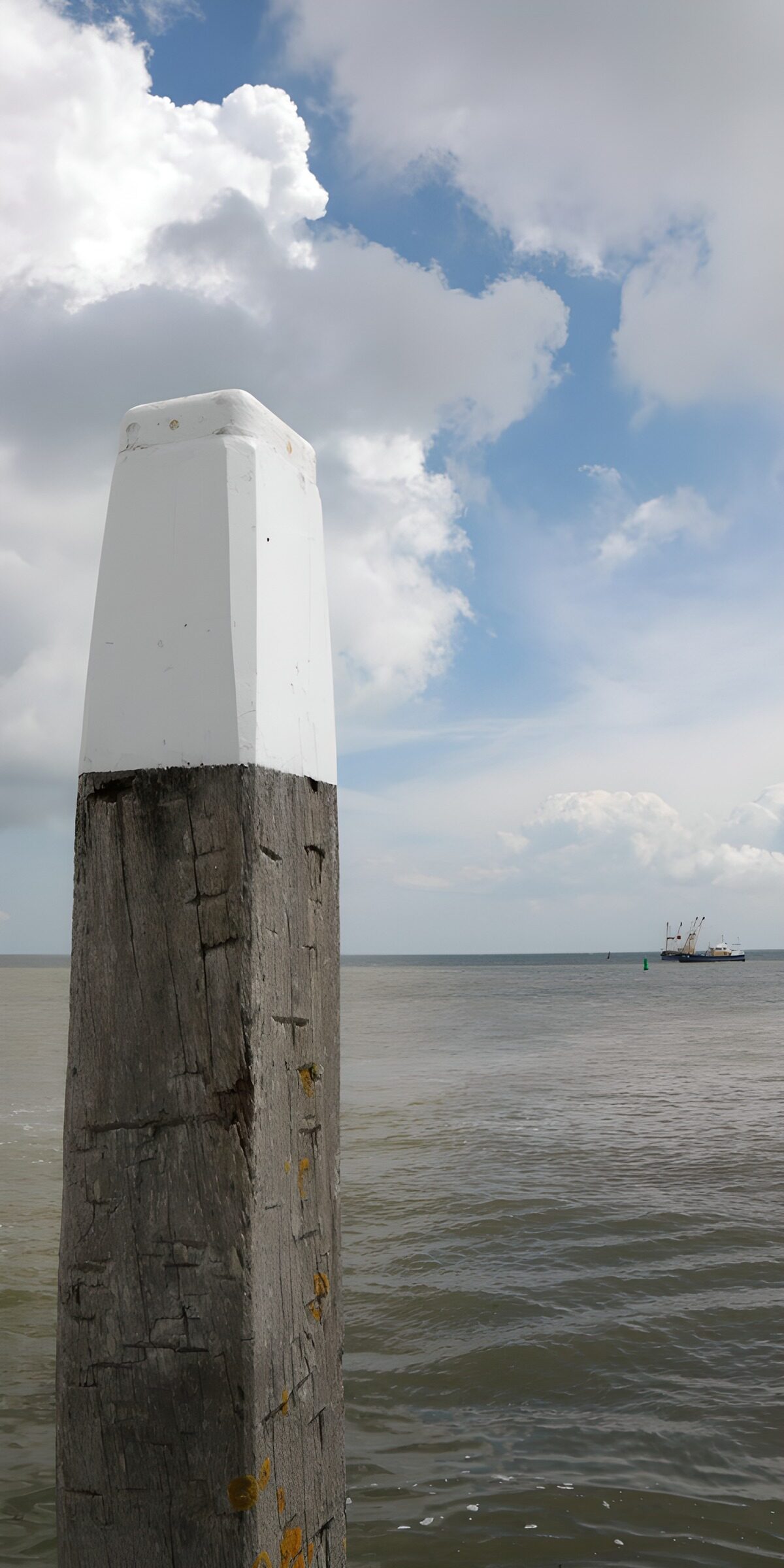 OCUK44902: Coastal Post Against a Dramatic Sky