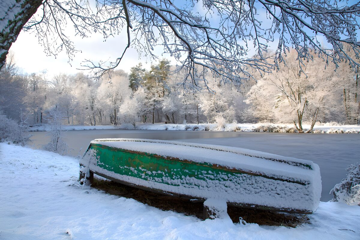 OCUK44738: Snow-Covered Boat by the Winter River