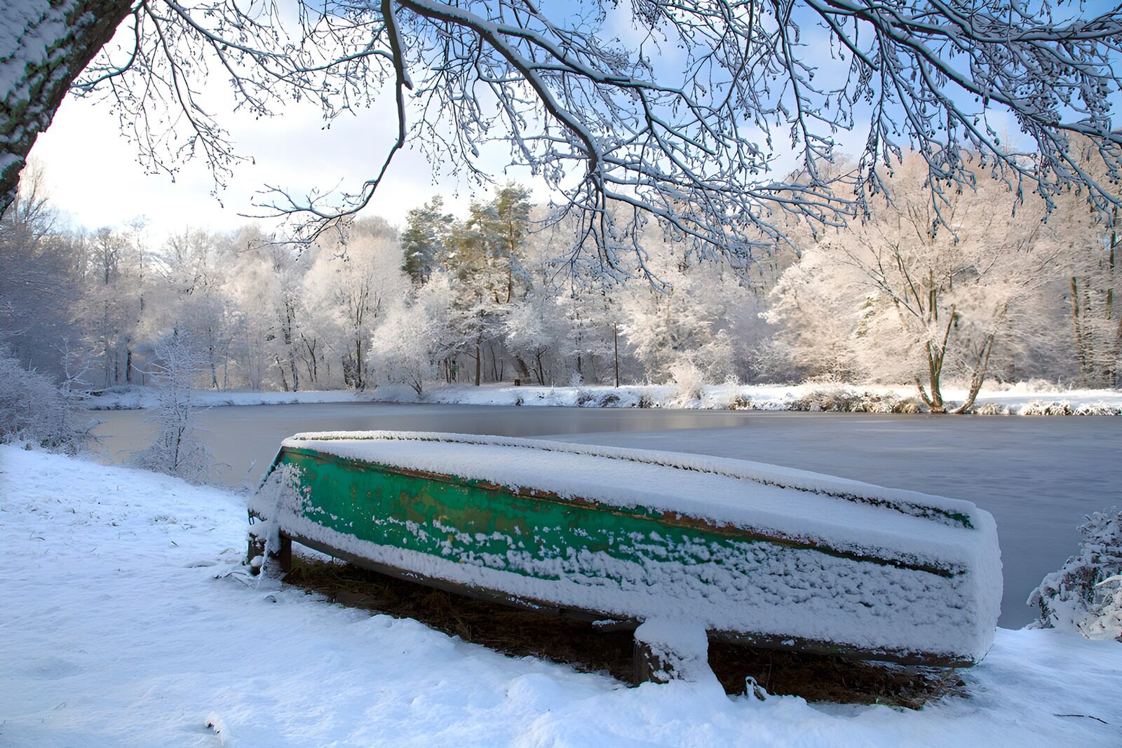 OCUK44738: Snow-Covered Boat by the Winter River