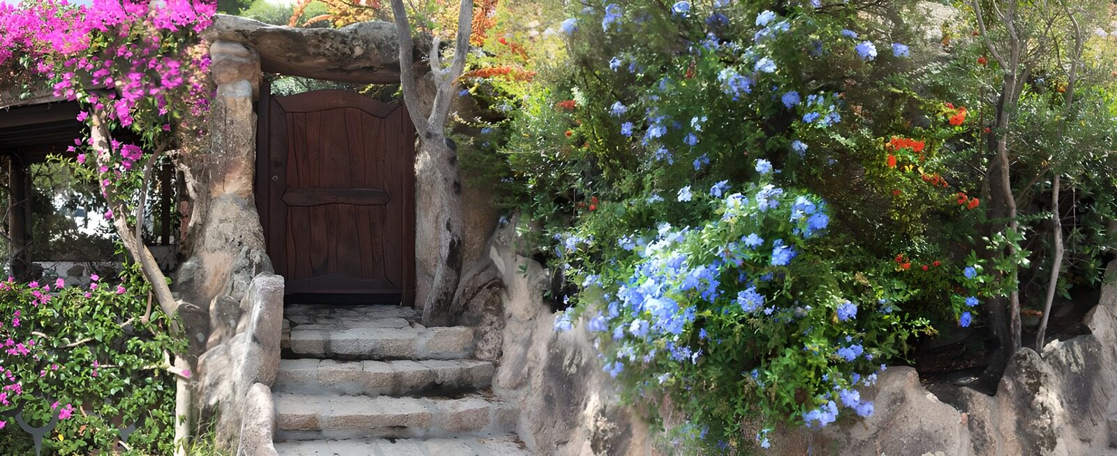 OCUK55401: Dark brown wooden door in garden between pink and blue flowers