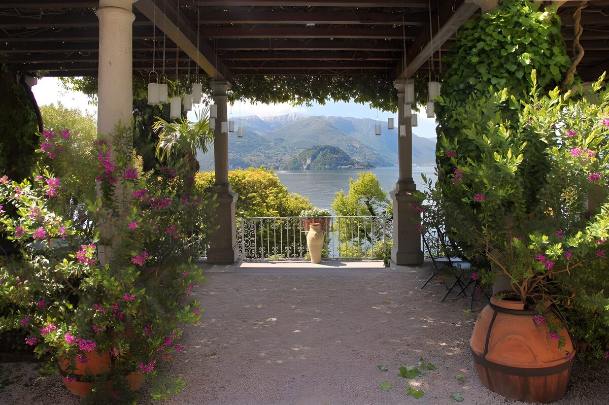 OCUK12774: Sun shade covered terrace with two flowerpots