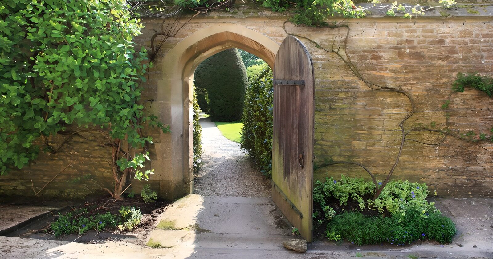 OCUK98789: Old brick wall with a wooden gate and an entry to a garden 2