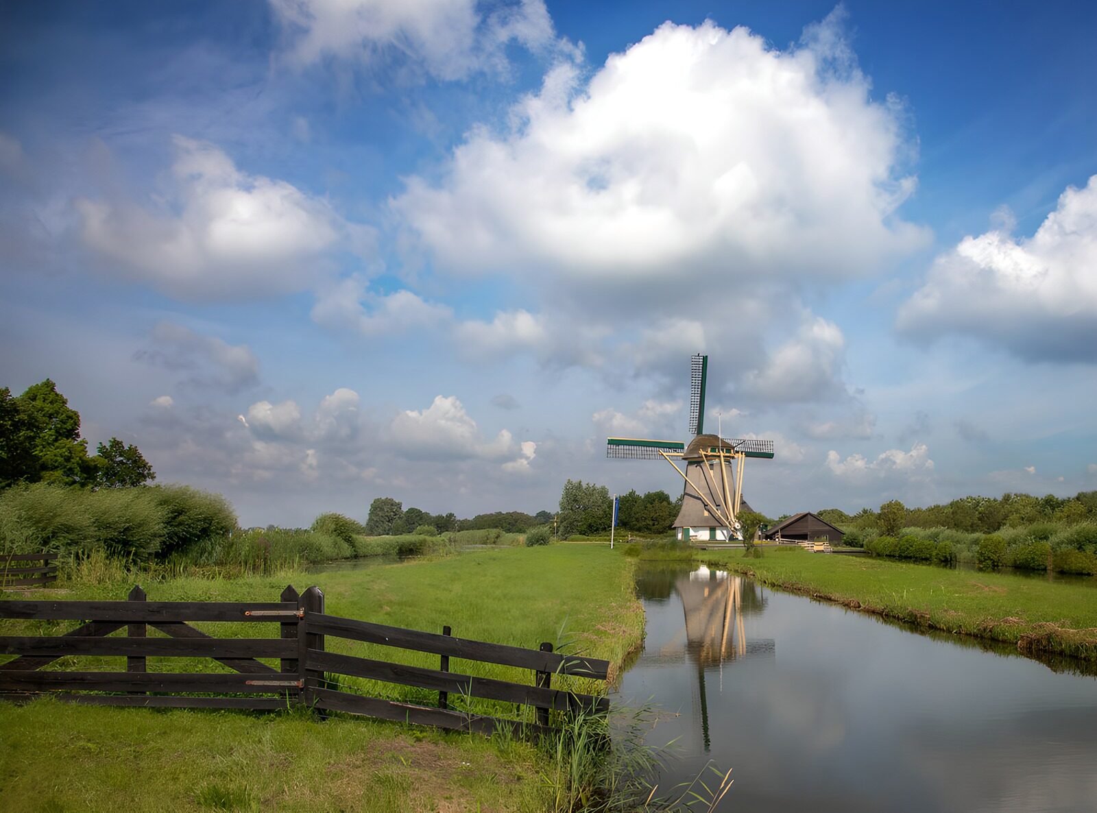OCUK14569: Tranquil Windmill by the Water