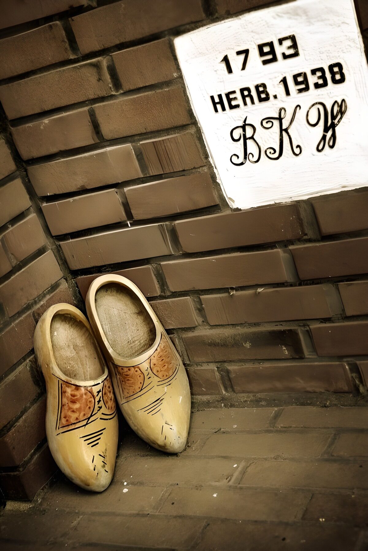 OCUK91528: Traditional Wooden Clogs by the Wall