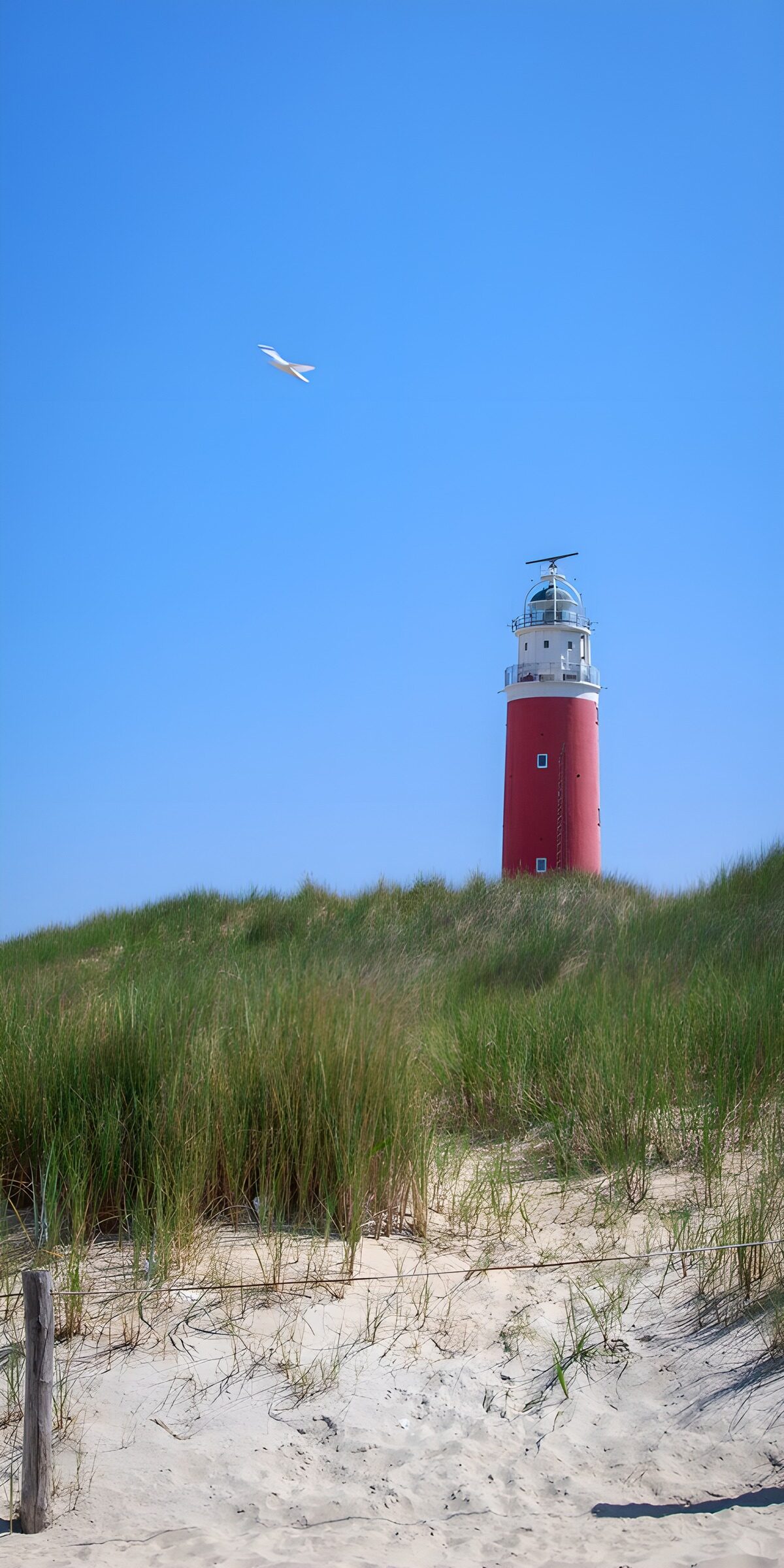 OCUK12030: Coastal Lighthouse Under Clear Sky