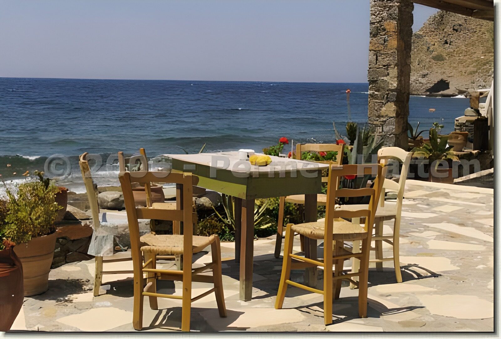 OCUK23307: Italian panoramic view over the sea with old table,and chairs