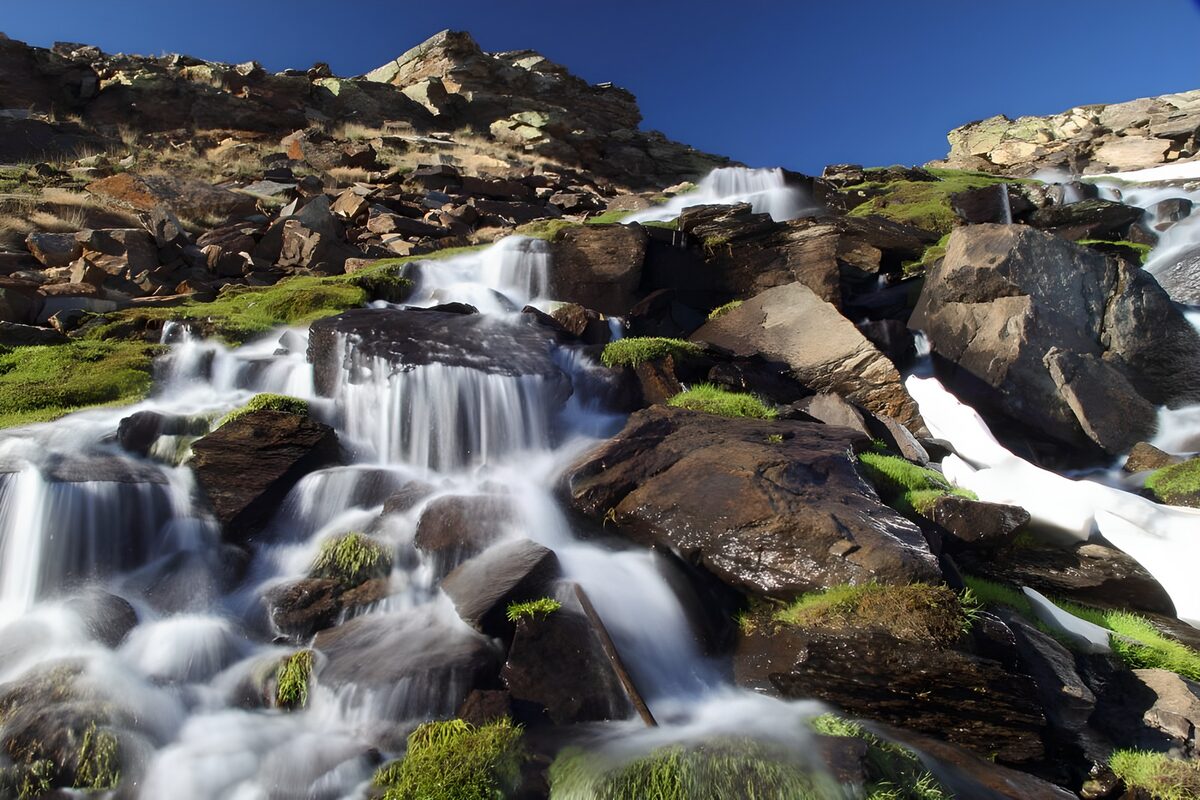 OCUK95700: Tranquil Mountain Waterfall