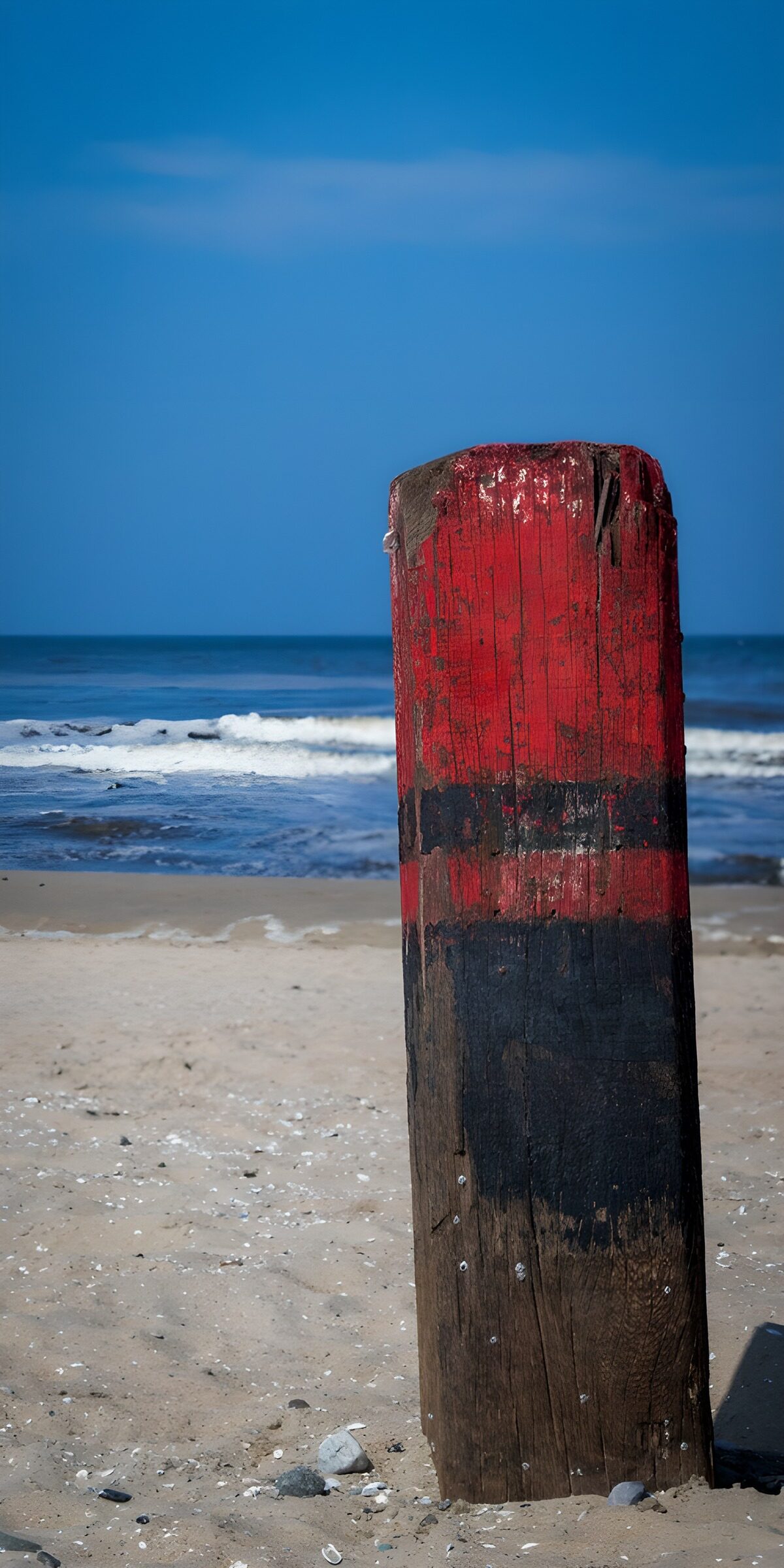 OCUK67275: Weathered Post by the Shore