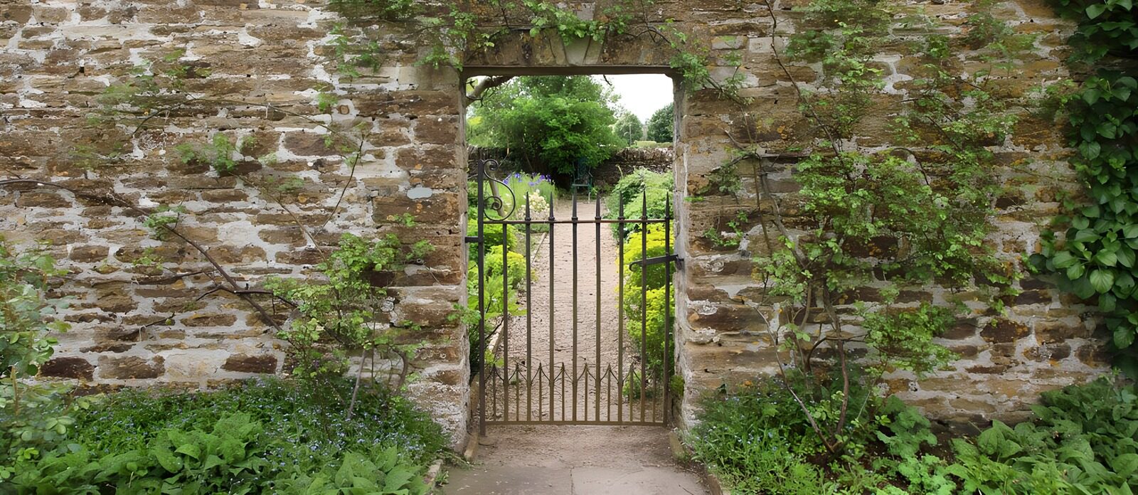 OCUK15212: Quaint Garden Gate Framed by Stone Wall