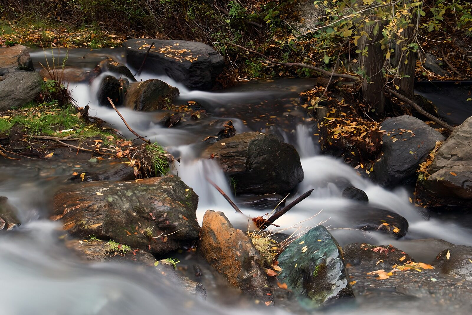 OCUK71745: Serene Stream Flowing Through Rocks