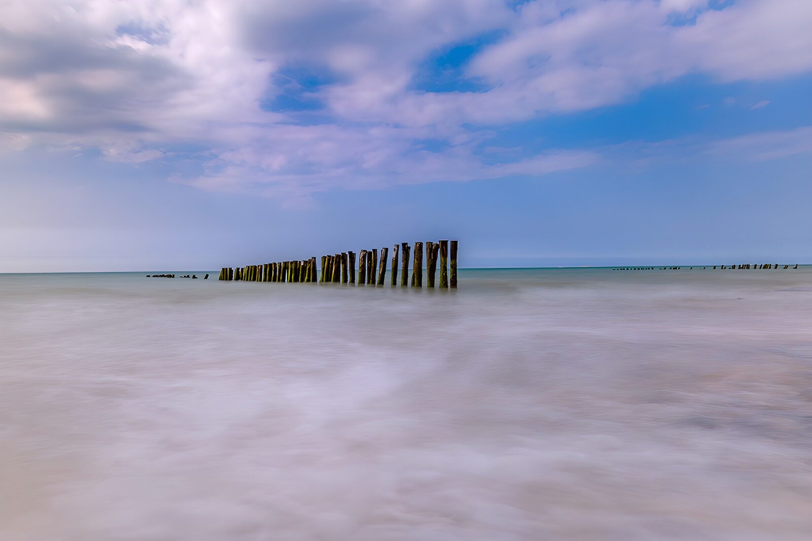 OCUK59303: Serene Waters with Wooden Posts
