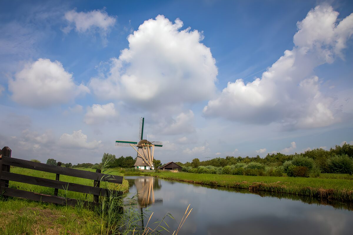 OCUK24358: Peaceful Windmill by the Water