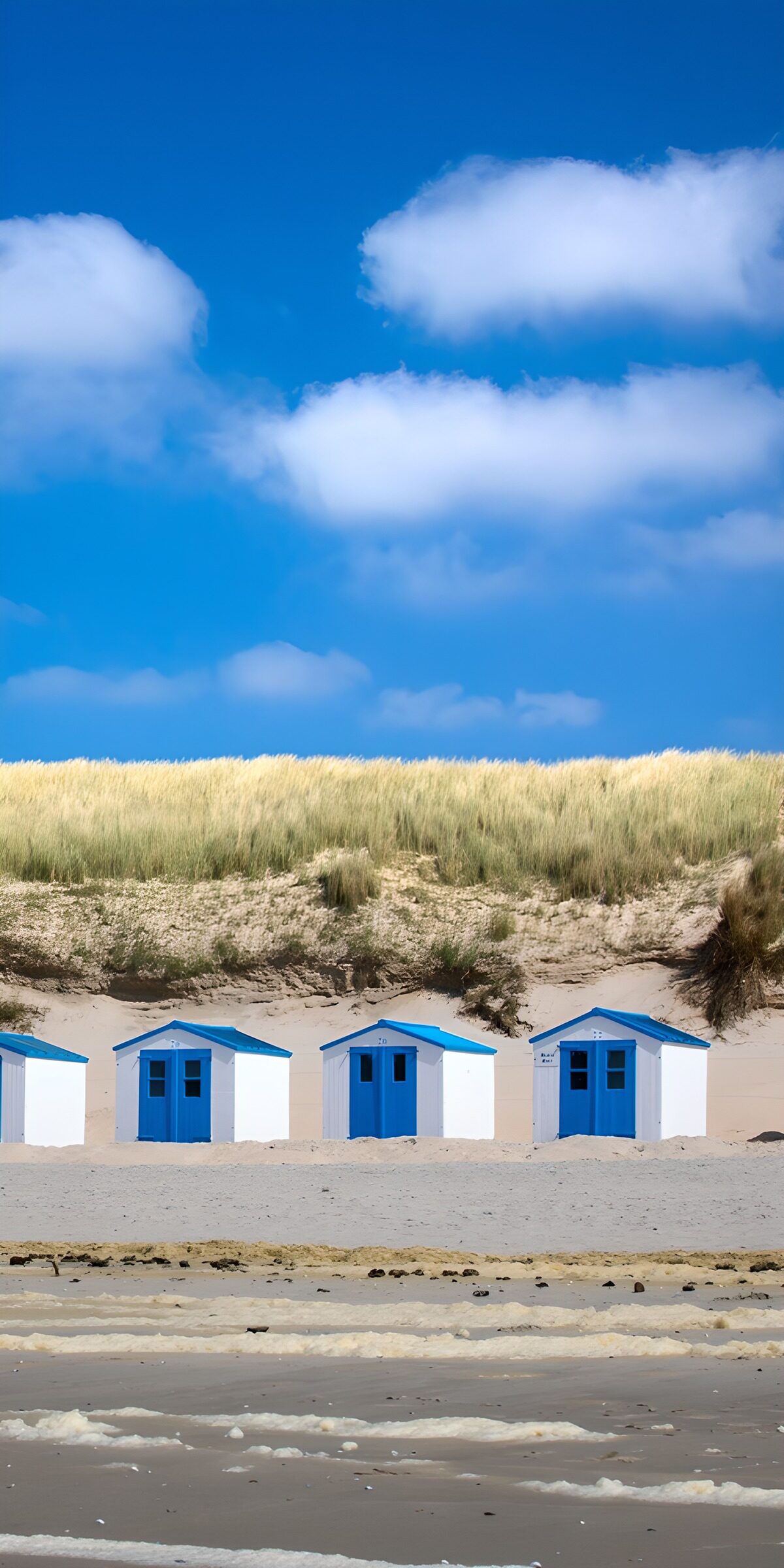 OCUK93015: Coastal Beach Huts with Blue Sky