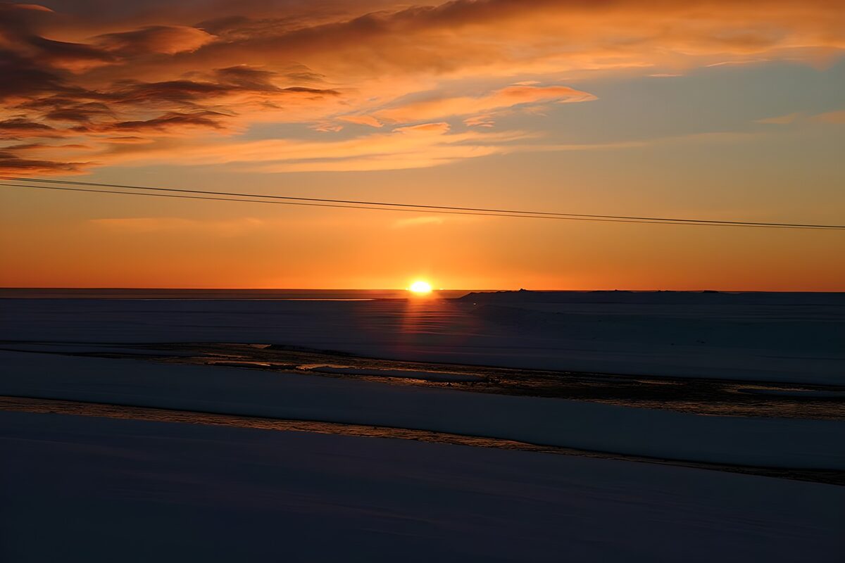 Tranquil Sunset Over Snowy Landscape