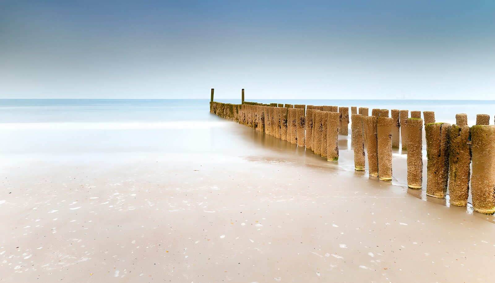 OCUK99822: Tranquil Shoreline with Wooden Graduates