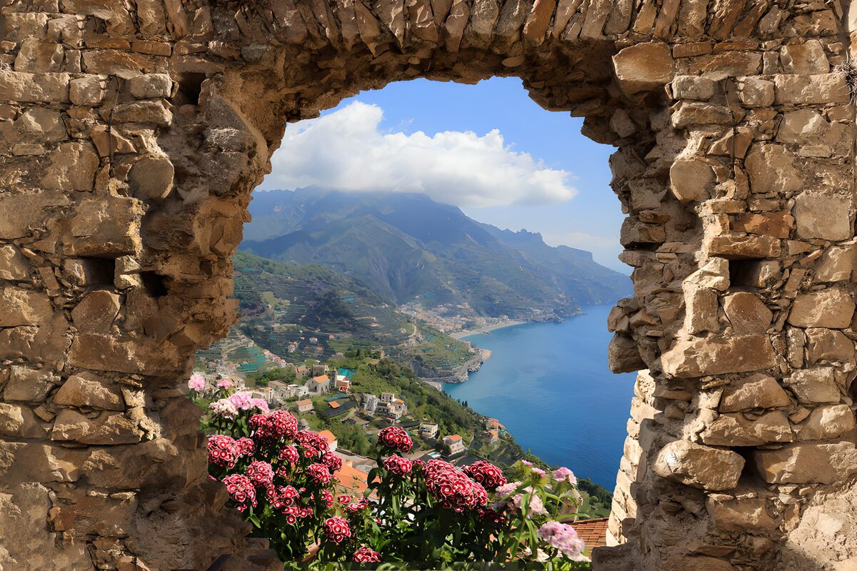 OCUK64716: Old brick wall with a doorway looking out at the sea