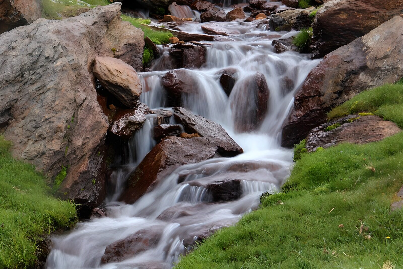 OCUK72342: Serene Waterfall Flowing Over Stones
