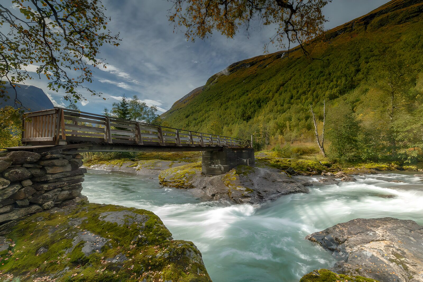 OCUK83929: Tranquil Bridge Over a Mountain Stream