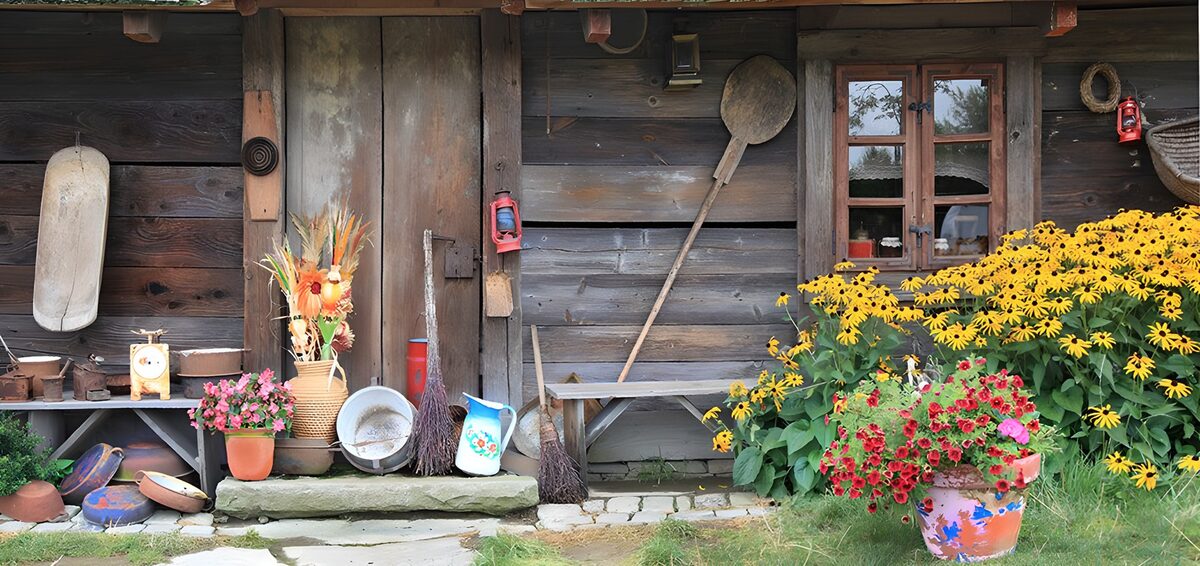Wooden barn with flowers, pots, candles, ...