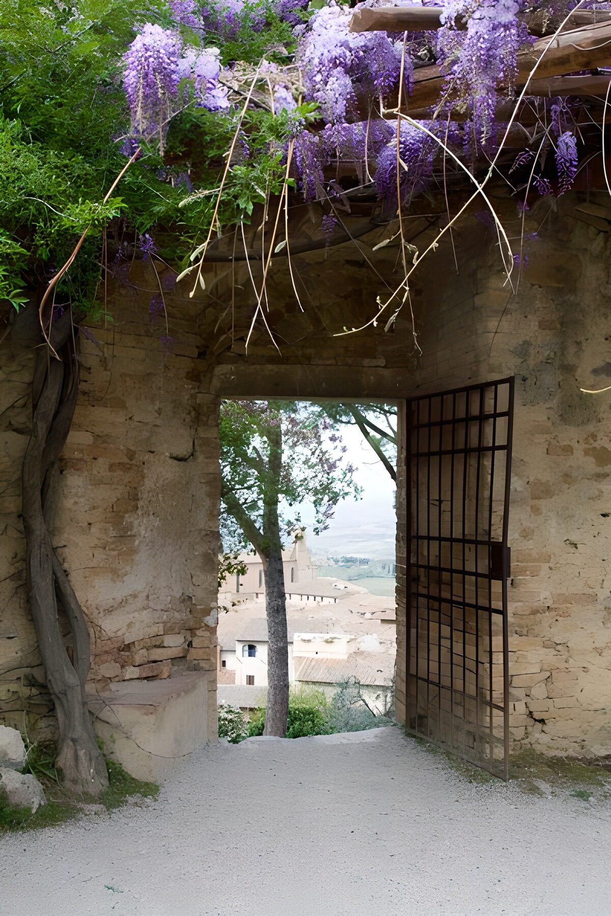 OCUK40421: Old metal gate with view to the village