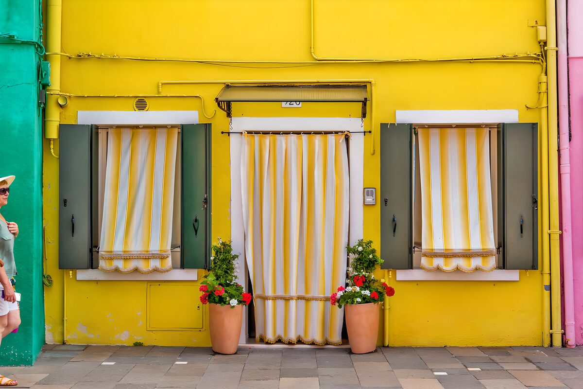 OCUK31423: Bright Yellow Facade with Shuttered Windows