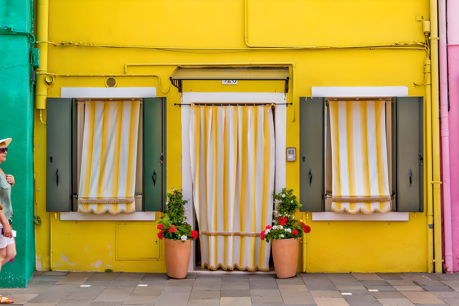 OCUK31423: Bright Yellow Facade with Shuttered Windows