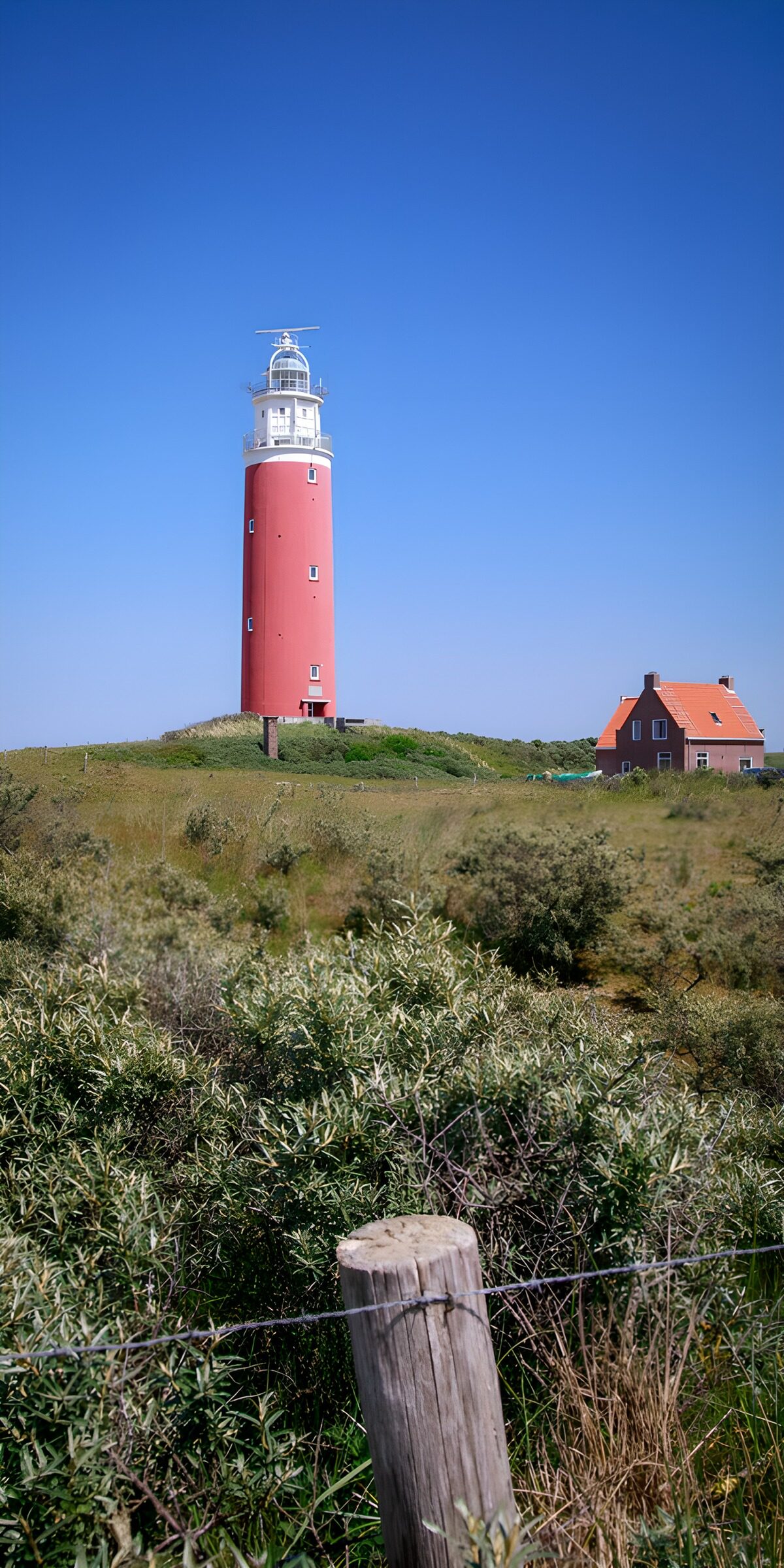 OCUK61764: Iconic Red Lighthouse by the Coast