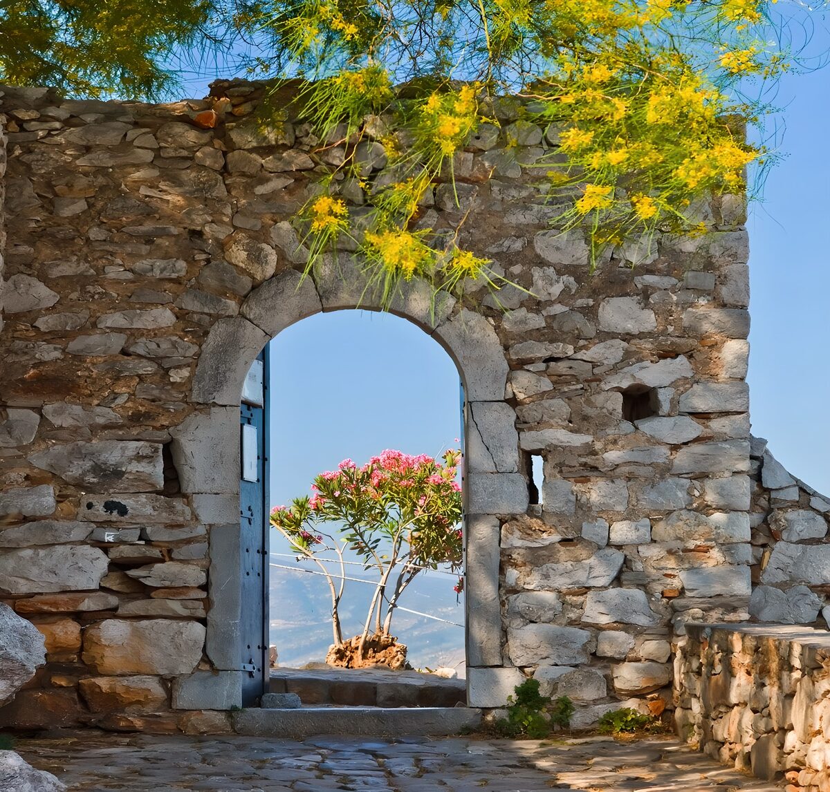 OCUK77413: Empty open door in an old wall