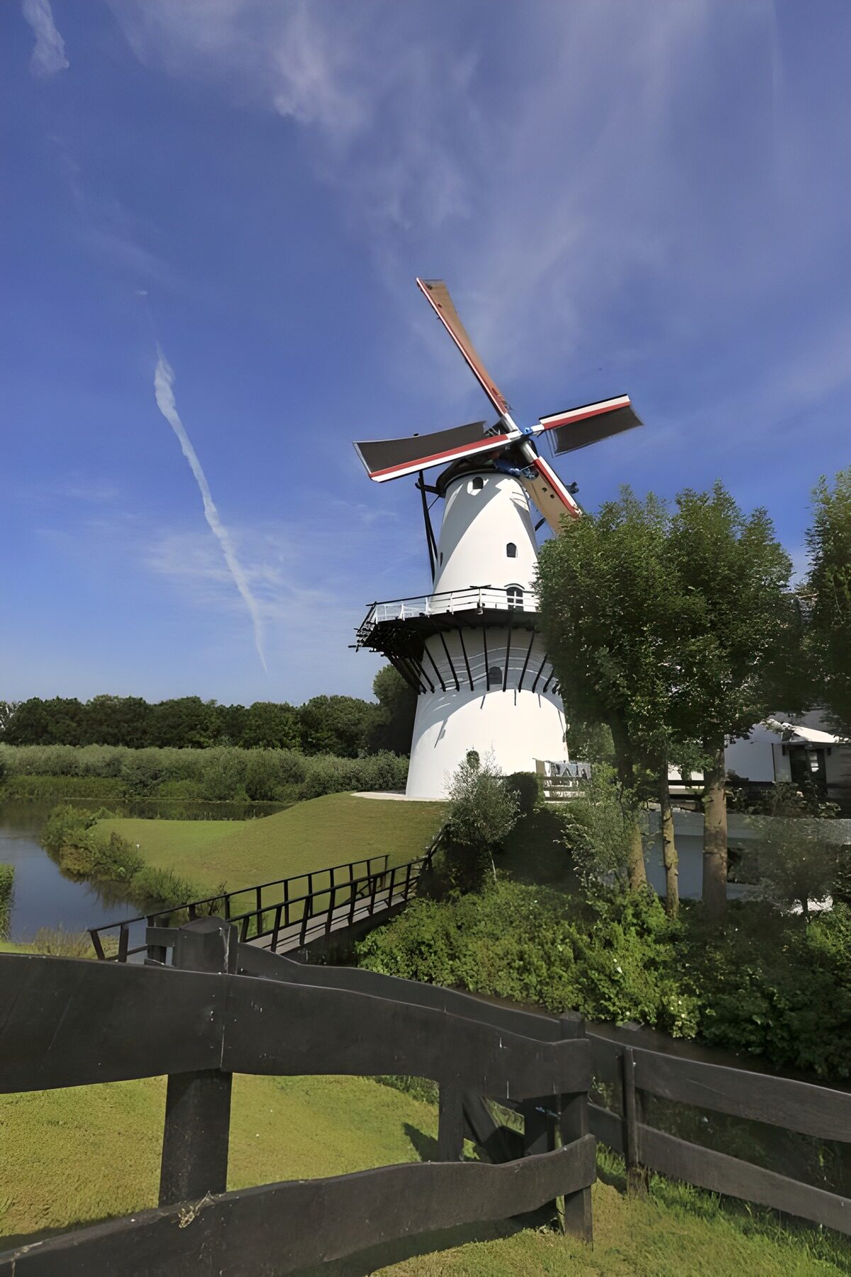 OCUK34101: White windmill at the water