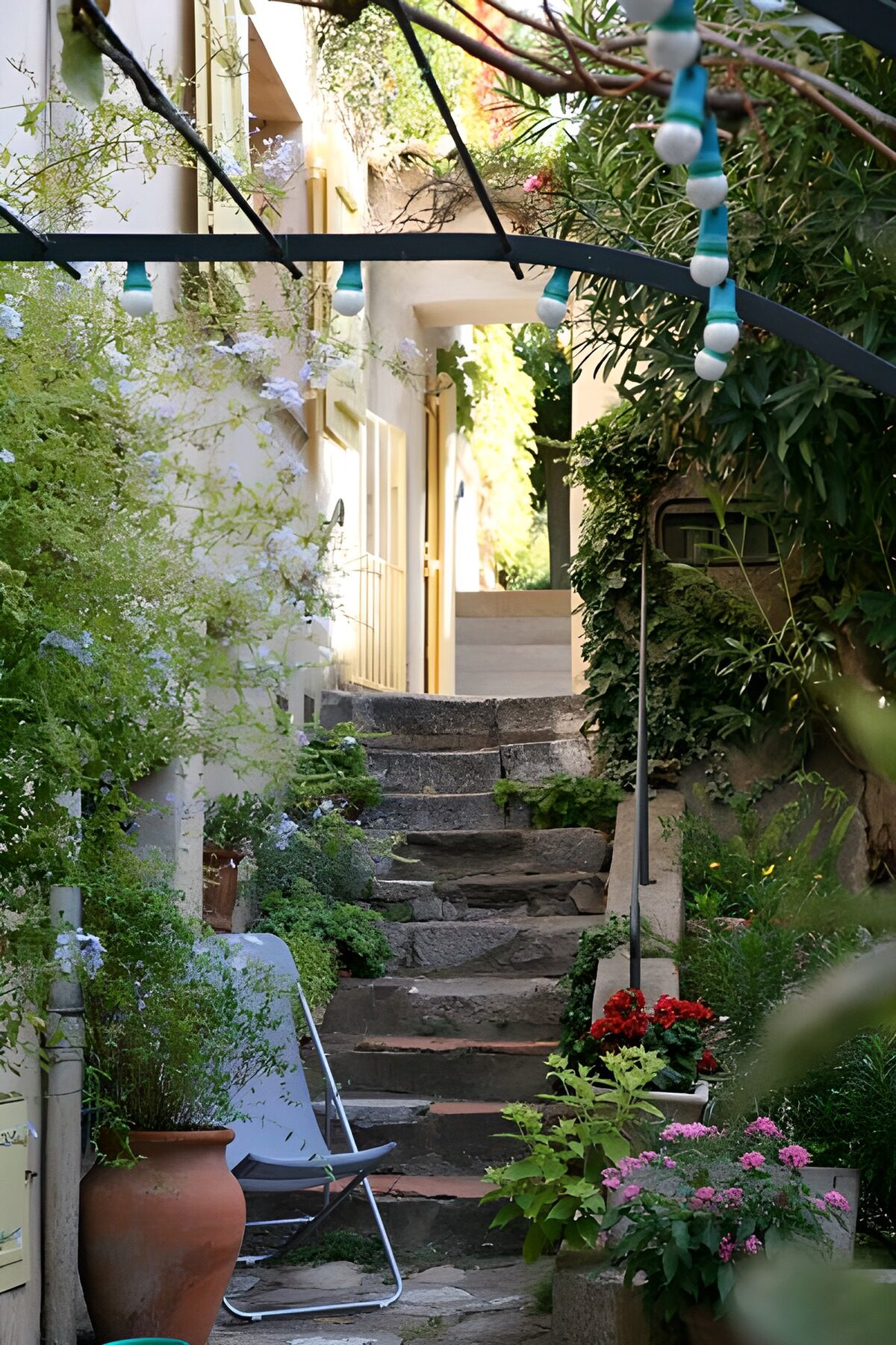 OCUK15798: Steps to house entrance with lights and chair