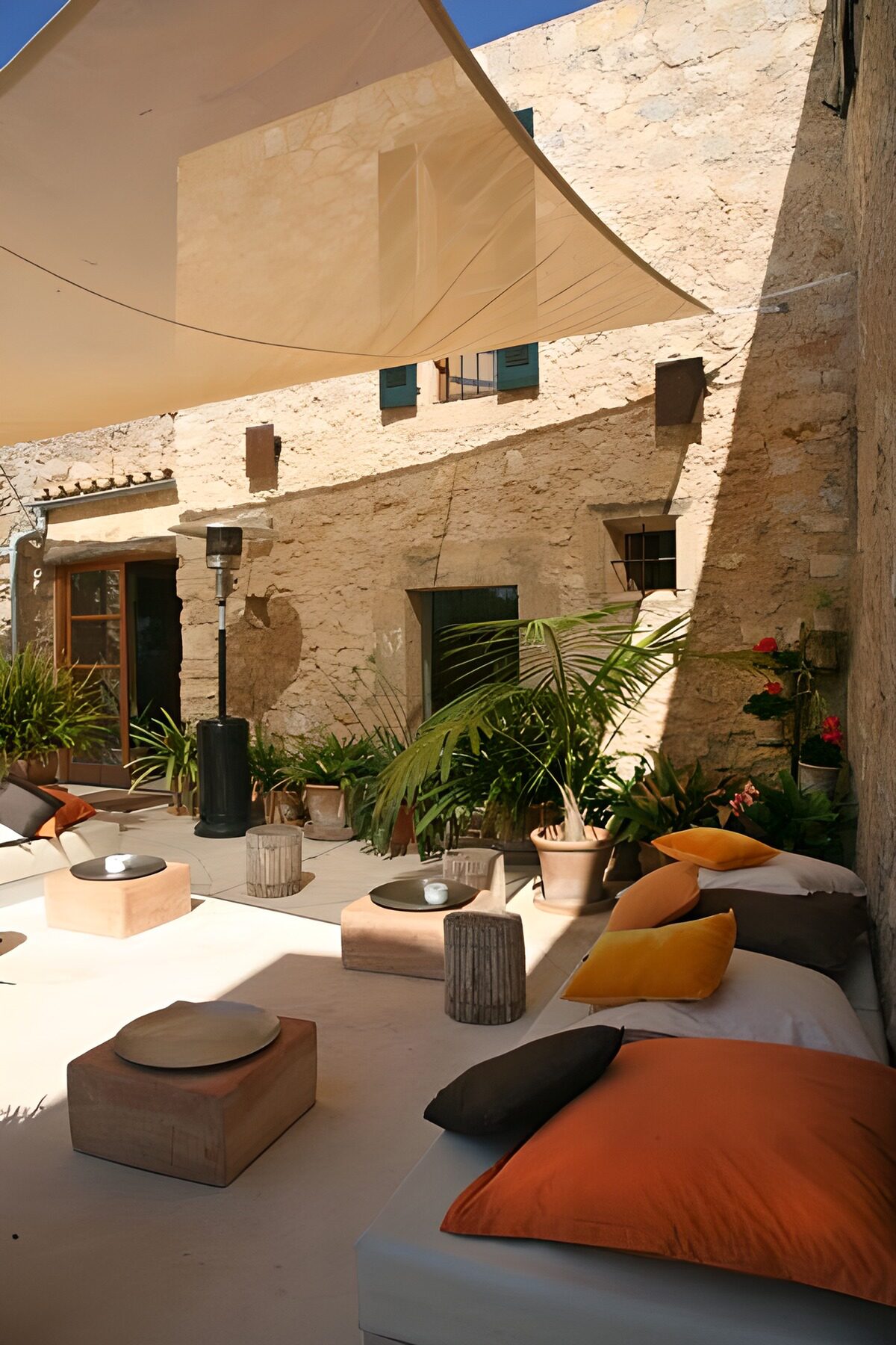 Corner of the lounge situated in the patio of house, with cushions