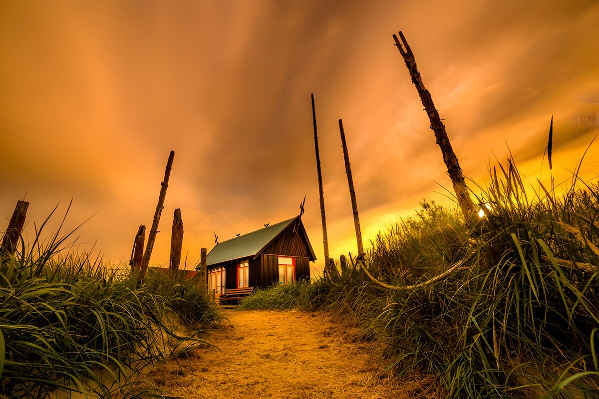 OCUK54755: Serene Sunset at the Rustic Cabin