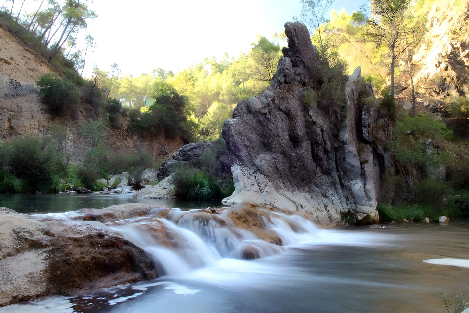 OCUK22266: Serene Stream in Nature's Embrace