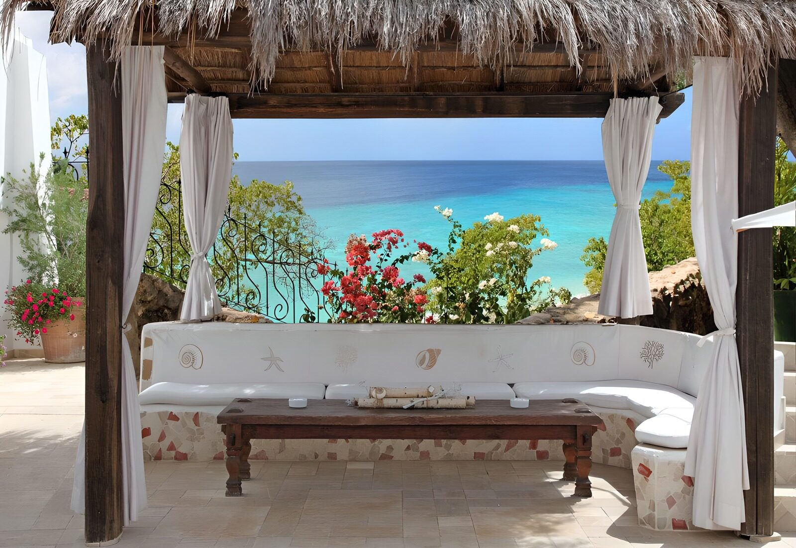 OCUK10581: Mediterranean terrace with white bench beneath pergola and mighty view on ocean