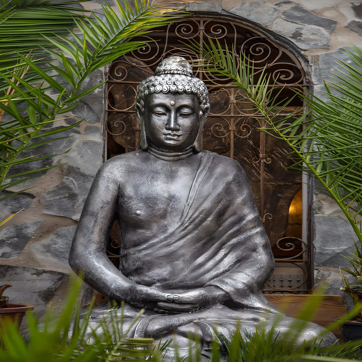 Serene Buddha Statue Surrounded by Nature