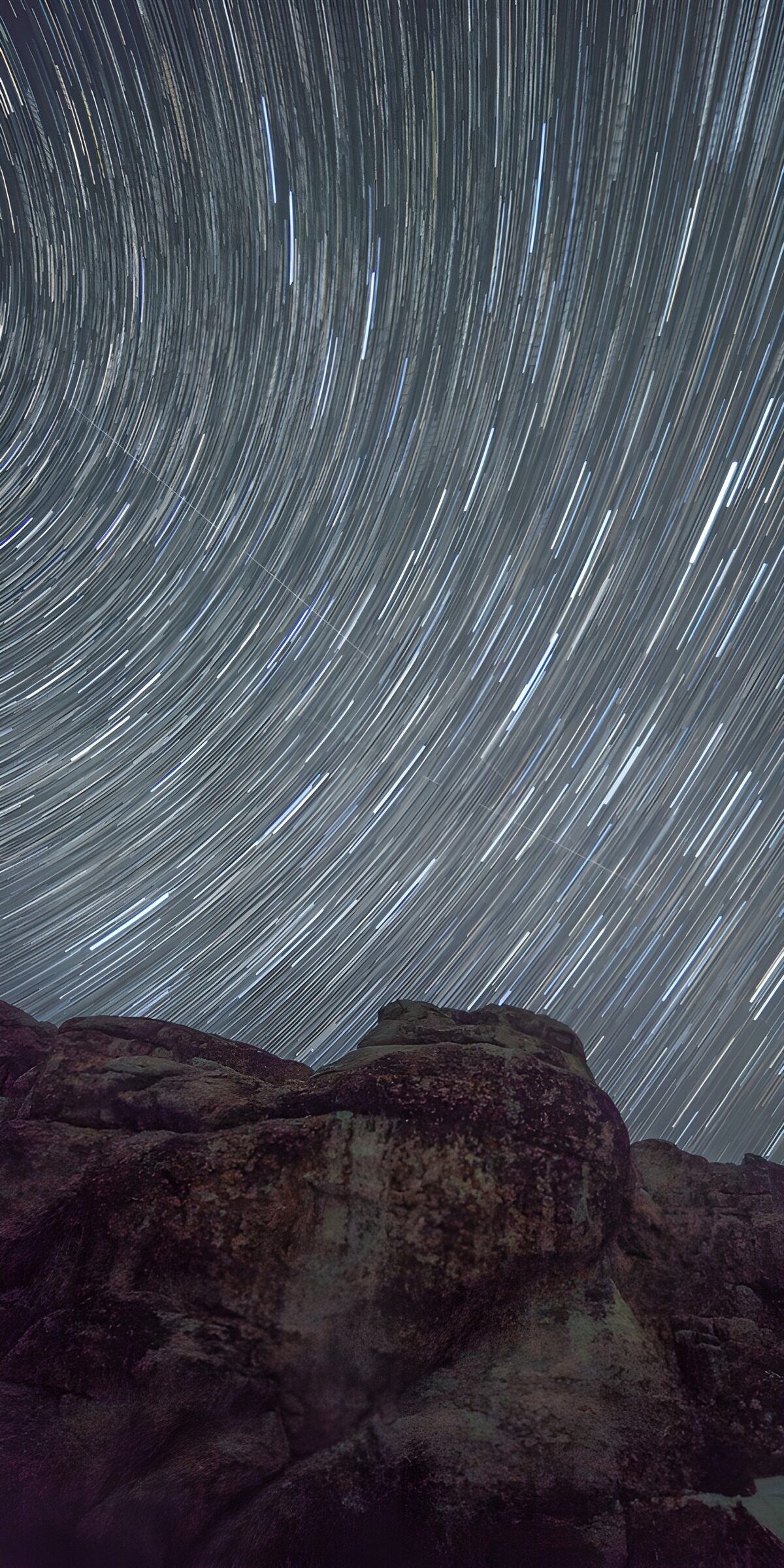 OCUK61875: Star Trails Over Rocky Landscape