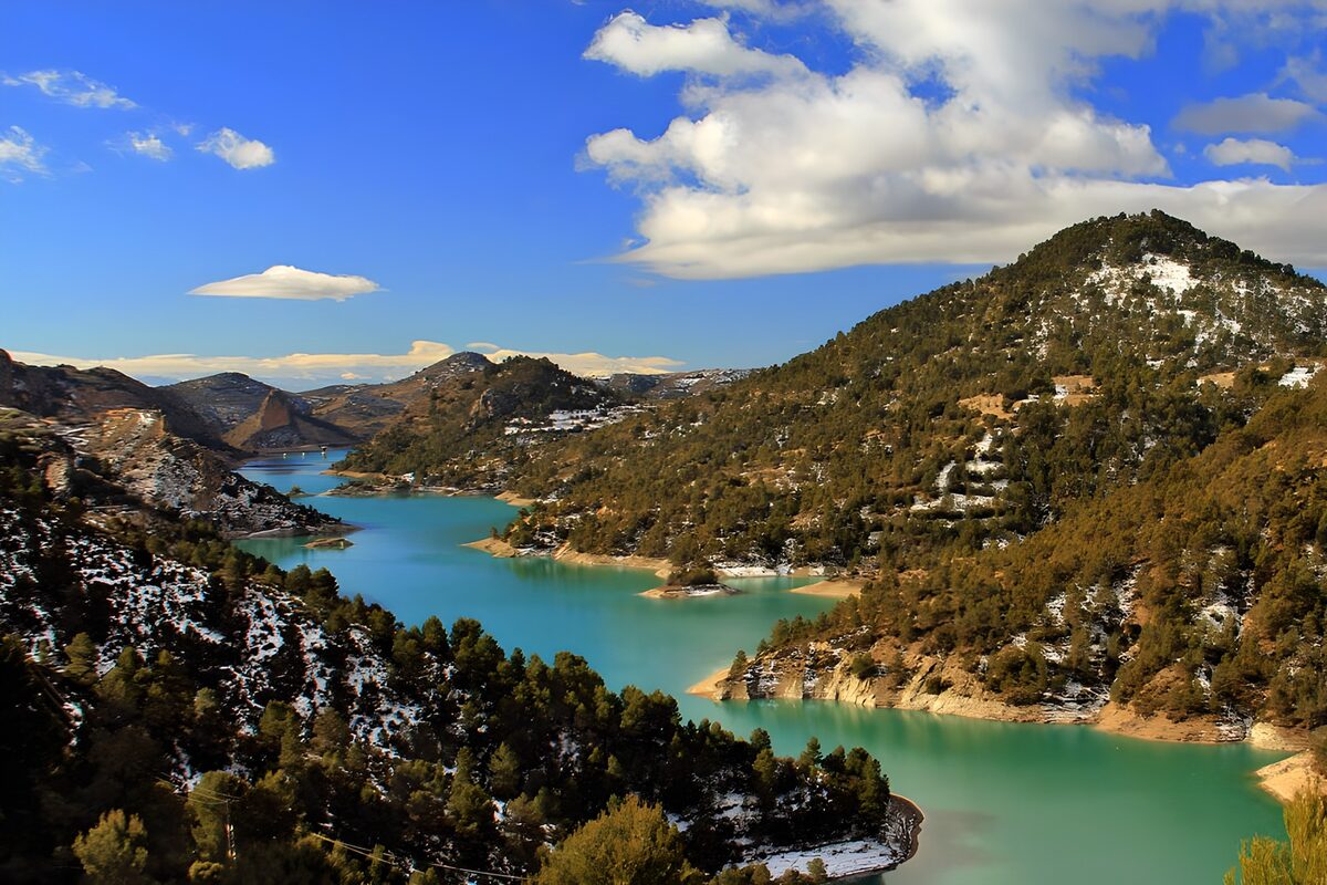 OCUK29766: Serene Blue Waters Amidst Scenic Hills