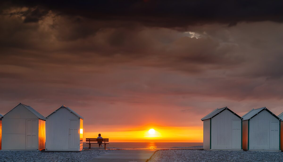 OCUK84478: Serene Sunset by the Beach Huts