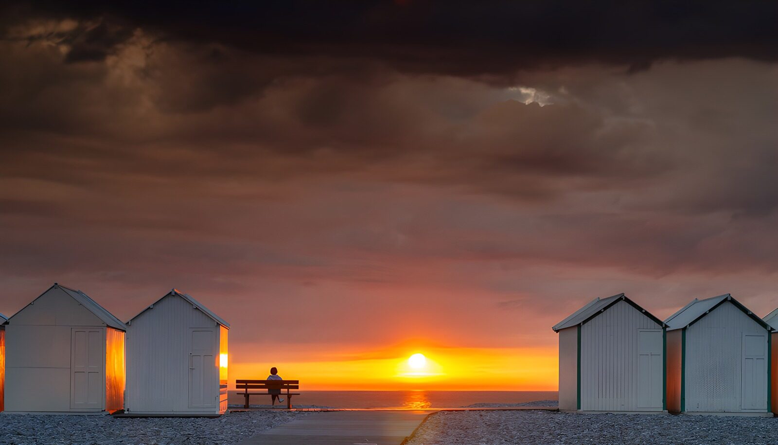 OCUK84478: Serene Sunset by the Beach Huts