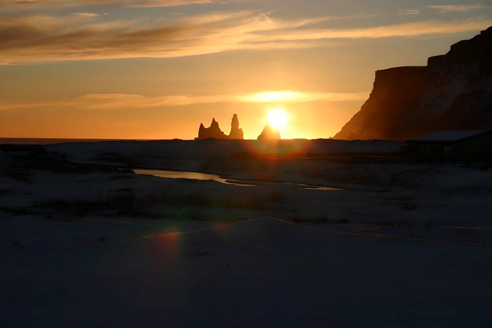 OCUK69961: Sunset Over Silhouetted Cliffs