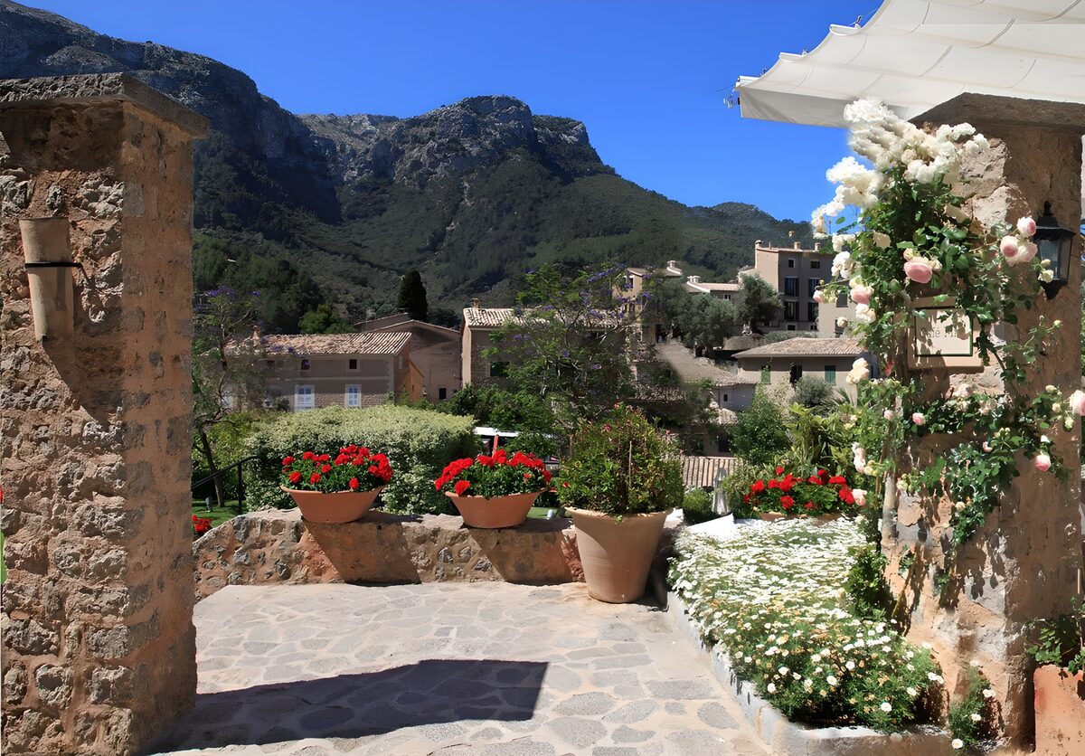 OCUK75762: Brick covered terrace with colourful flowers and lookout at mountain