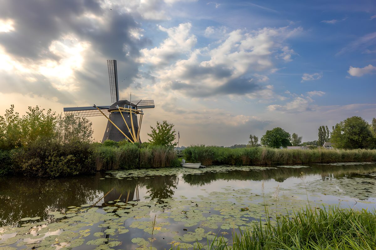 OCUK54151: Tranquil Windmill by the Water
