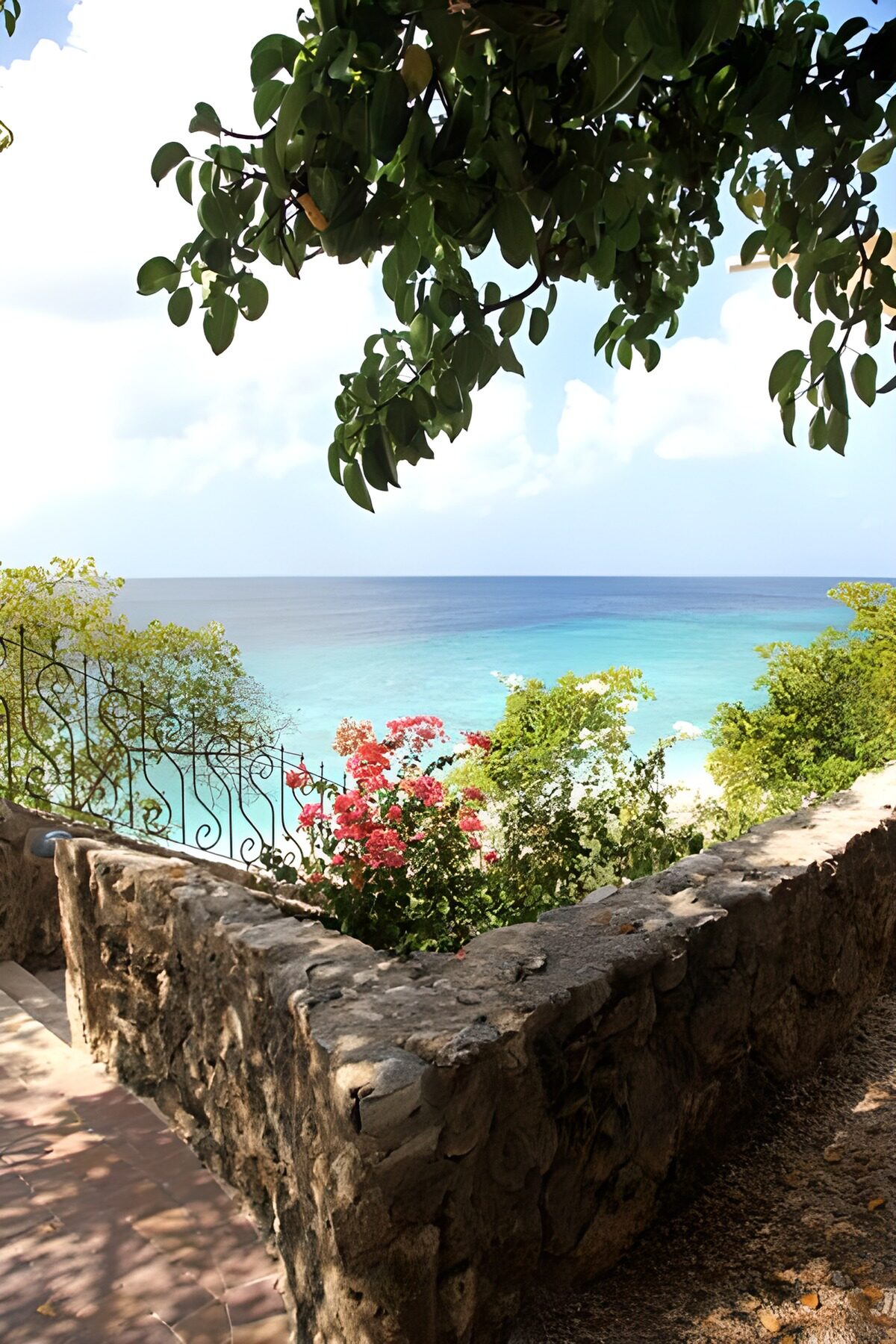 View over the sea with a brick wall in Curacao