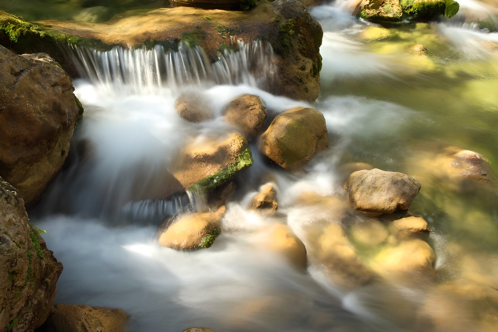 OCUK48661: Serene Stream Flowing Over Rocks