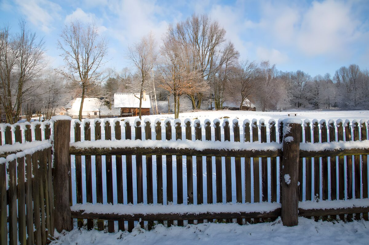 Snowy Winter Scene with Rustic Fence